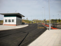 A staff building and some bus stops. The tram stop is just off-camera to the right